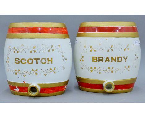 A pair of Victorian porcelain spirit barrels, one inscribed 'Scotch', the other 'Brandy'. 32 cm high.