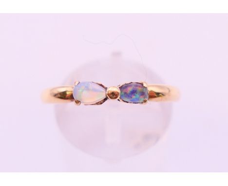 A 9 ct gold two-stone opal ring.  Ring size R/S.