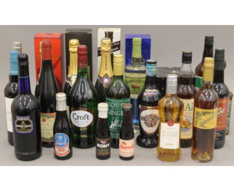 A quantity of various bottles of alcohol, including Harveys Bristol Cream, Remy Martin, Fine Champagne Cognac, Louis Roederer