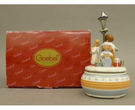 A boxed Goebel music box. The outer box 22 cm wide.