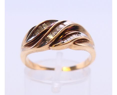 A 9 ct gold and diamond ring. 2 grammes.  Ring size Q.