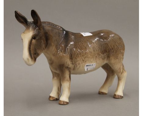 A Melba ware donkey. 19 cm high.