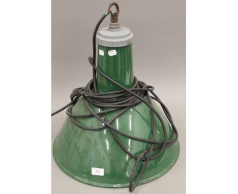 A green enamel industrial hanging light. 50 cm high.