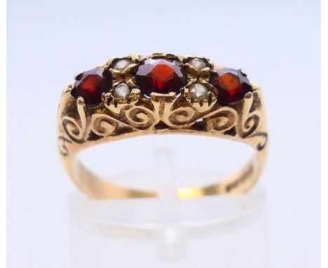 A 9 ct gold garnet ring.  Ring size O. 