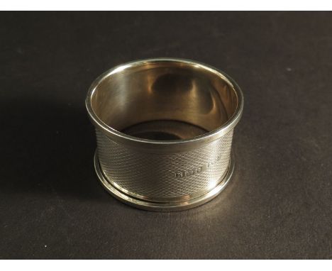 A silver napkin ring