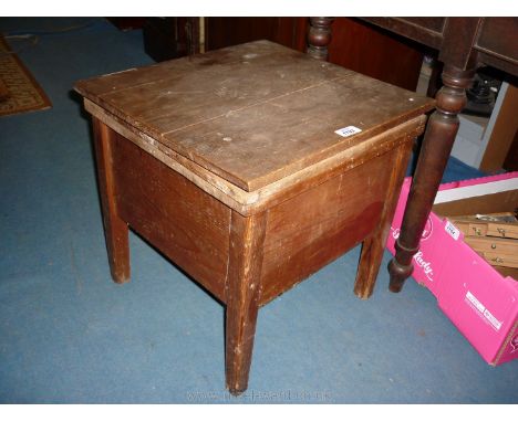 A stained Pine box Commode with enamelled internal fitting.