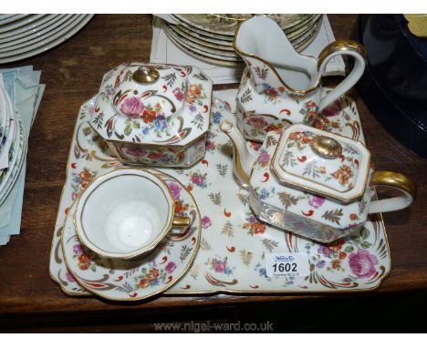 A Limoges Teaset for one to include; teapot, jug, sugar bowl, cup/saucer and ceramic tray.