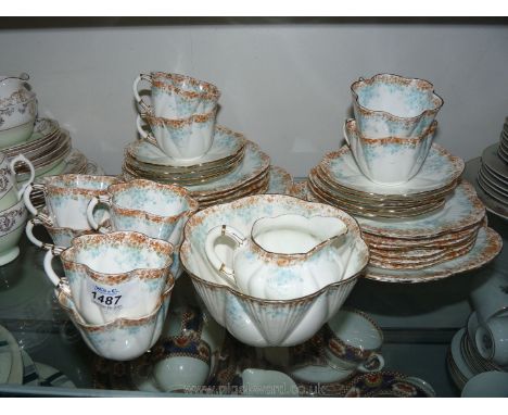 A Foley light green and gold embossed part Teaset including 10 teacups and 9 saucers, a milk jug, sugar bowl, 12 tea plates a