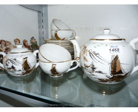 A Chinese part  Teaset, made in Hong Kong to include four cups, five saucers, six side plates, teapot, milk jug and sucrier, 