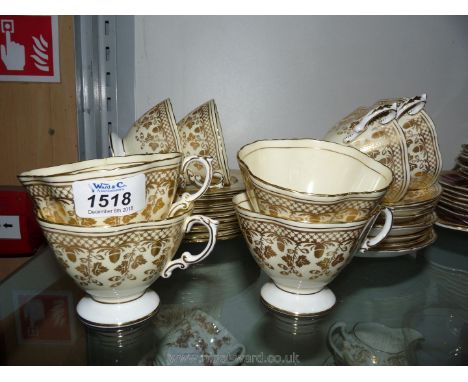 A Hammersley &amp; Co; Jenners part Teaset in gold and white with acorn design including eight cups, eight saucers and ten te