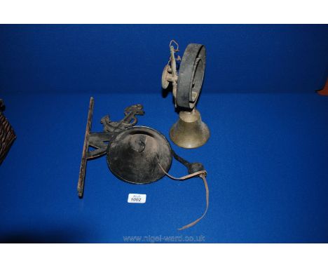 Two old doorbells, one bracket the other on a spring.