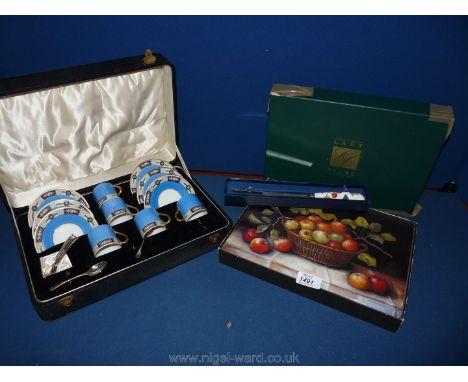 A boxed coffee set C.T. Altwasser, Germany (one cup missing), a box of Lady Care place mats and a boxed Royal Worcester knife