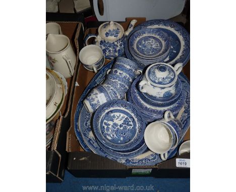 A large quantity of blue and white china to include cups, saucers, plates, teapot, sugar bowl, jug and two meat plates.