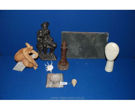 A quantity of miscellanea including a door stop, an onyx lighthouse, a stone model of a woman, an onyx mouse, ashtray and two