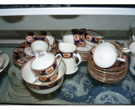 A part English made 5807 Teaset consisting of two bread and butter plates, 12 tea plates, 12 saucers, 10 cups, a slop bowl an