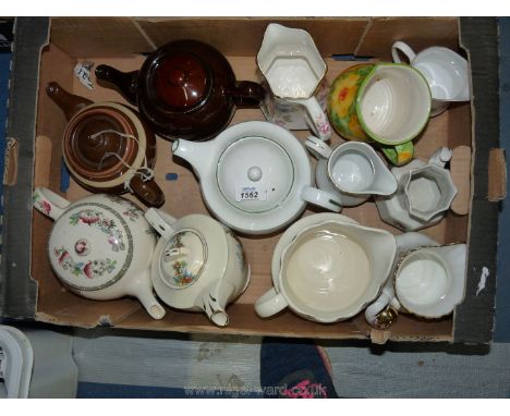 Five teapots to include a Johnson Bros. Indian tree design, Royal Worcester 'Poppies', etc; together with seven jugs includin