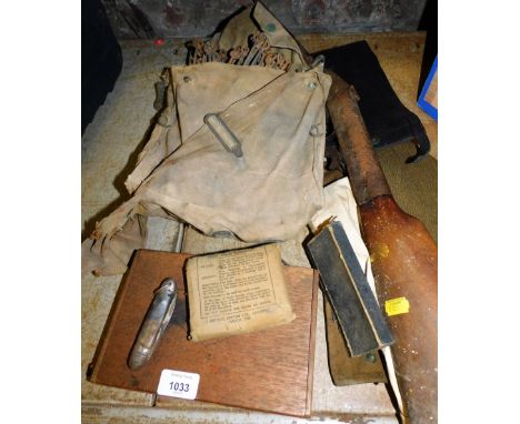 A cigar box, field dressing set, pen knife, army hat, child's toy gun, etc.