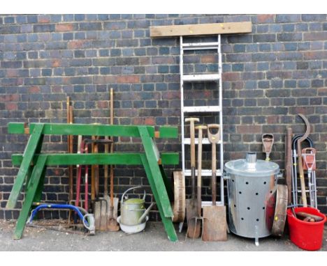 Various garden tools, galvanized metal watering can, step ladder, various hand tools, scythe, green painted table base, metal