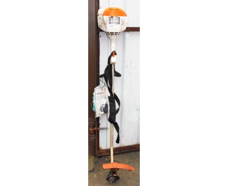 A Stihl strimmer, with Stihl poly cut 6-3 three blade cutting head, instruction manual, etc. 