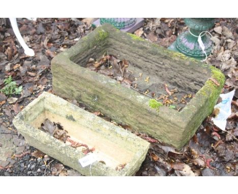 A SANDSTONE TROUGH, and a composite rectangular planter 66cm x 46cm x 23cm (2)