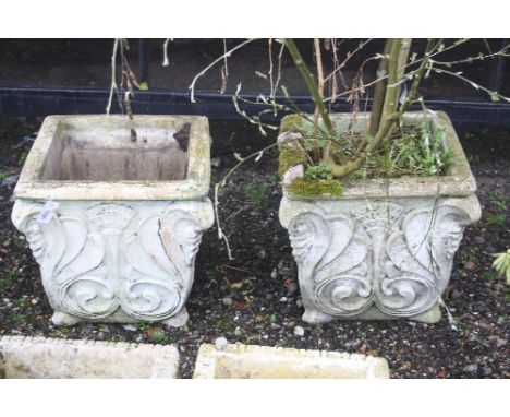A PAIR OF LARGE SQUARE COMPOSITE PLANTERS, with shrub in one planter, 48cm high (2)