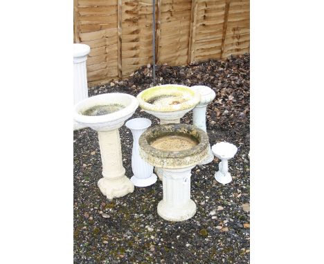 THREE COMPOSITE BIRD BATHS, on columns, two ceramic jardiniere stands and another bird bath (6)