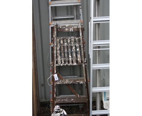 A SET OF ALUMINIUM EXTENSION LADDERS, 300cm long, an aluminium step ladder, 210cm long, a wooden step ladders 130cm long and 