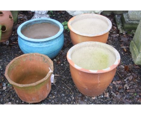 A LARGE GLAZED GARDEN PLANTER, a terracotta planter and two other planters (4)