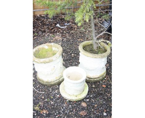 TWO COMPOSITE ROUND PLANTERS, one with shrub and a small matching planter, large planter 44cm high (3)