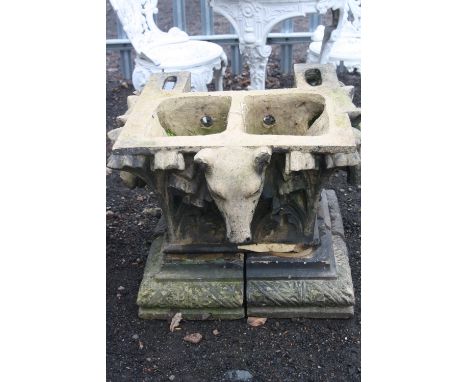 A GIBBS & CANNING ARCHITECTURAL WATER SPOUT, used as garden planter, 53cm high x 64cm depth x 64cm width