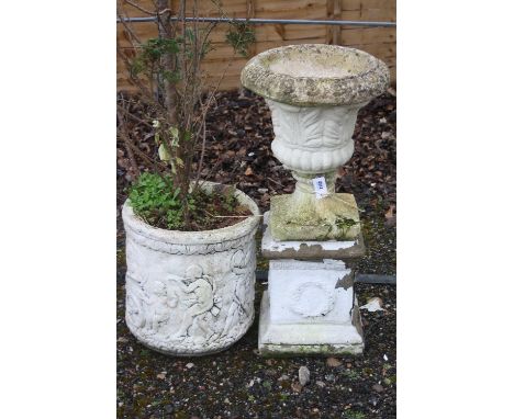 A LARGE ROUND PLANTER, and a composite urn on stand, 90cm high (2)