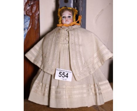 Victorian ceramic German doll with original clothing