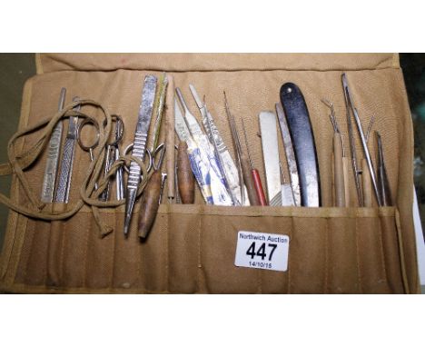Roll of medical tools including scalpels, probes etc