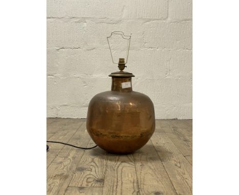 A decorative planished copper lamp base H45cm