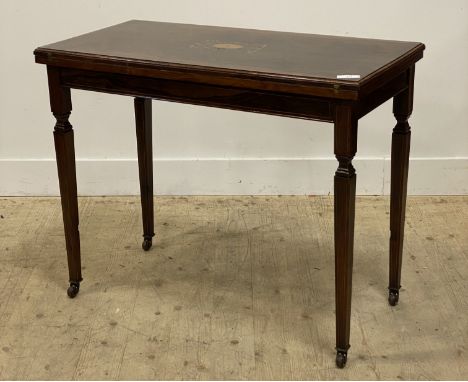 An Edwardian rosewood card table, the boxwood strung and marquetry top folding and revolving to reveal a baize lined playing 