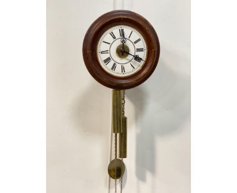 A late 19th / early 20th century postmans alarm clock, the white enamel dial with Roman chapter ring. D29cm.
