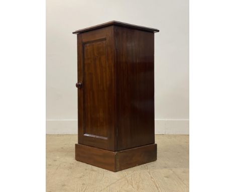 A 19th century mahogany pedestal bedside cabinet, with single panelled door enclosing a shelf, raised on a plinth base. H82cm