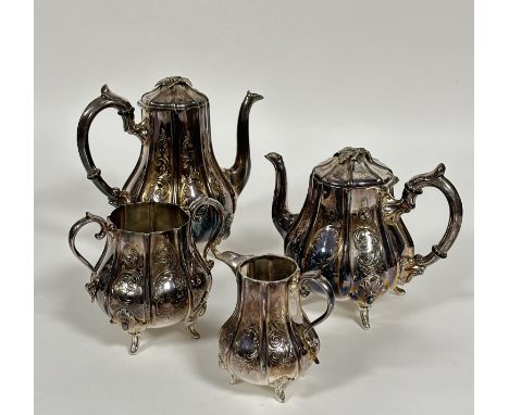 An Edwardian Epns panel sided baluster four piece tea service including, tea and coffee pots, two handled sugar basin and mil