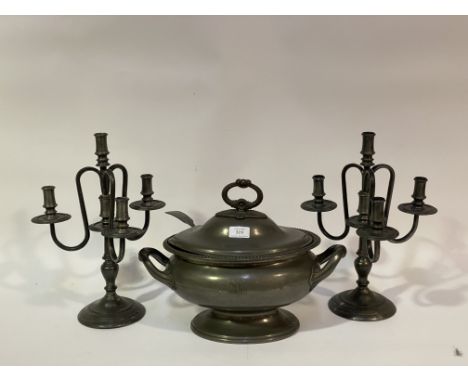 A pair of French pewter four branch candelabra, (H38cm) together with a pewter soup tureen and ladle. with loop handle to lid