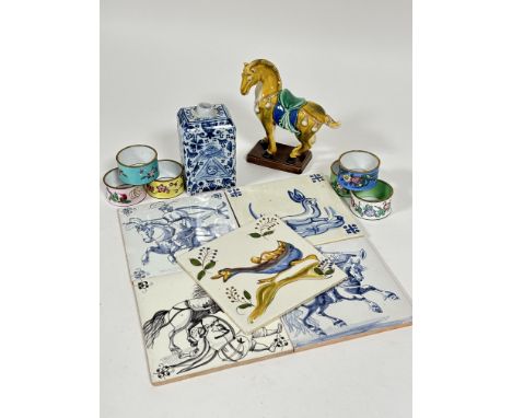 A mixed lot containing, a Delft tea caddy, a set of five Delft tiles, a miniature Tang style horse figure, and a set of six C