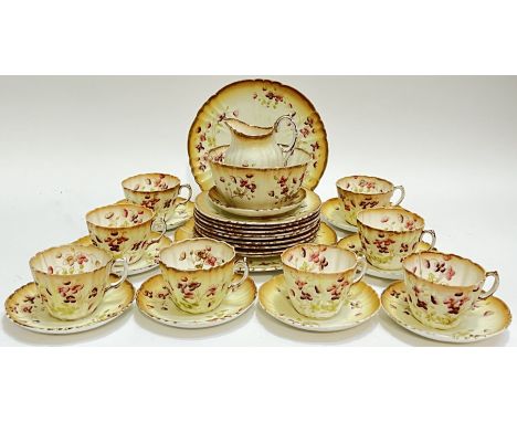 A Royal Albert Crown China part tea service comprising eight cups, nine saucers, nine trio/side plates, a sugar bowl, a milk 