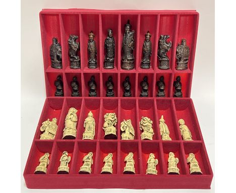 A full boxed set of Gino Ferrari resin chess pieces modelled as Chinese figures