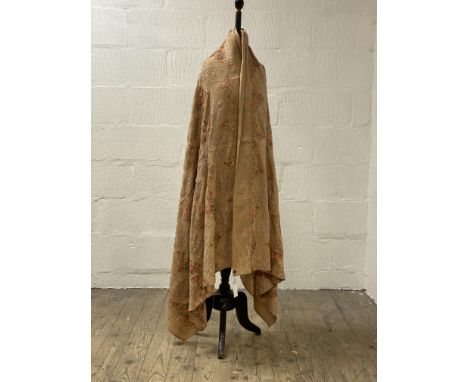 An embroidered woollen shawl, worked in a design of floral lozenges 218cm x 105cm.