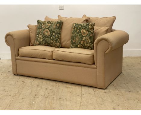 A traditional upholstered two seat sofa bed. H72cm, W174cm, D100cm.