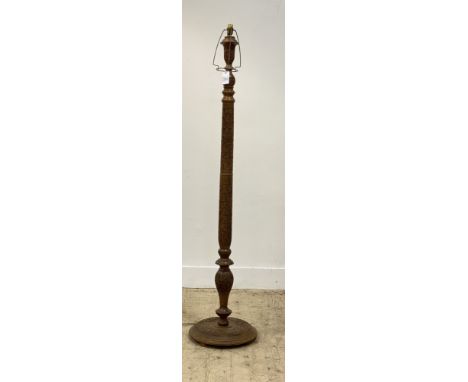 A Kashmiri style floral carved and turned teak lamp standard, H156cm.