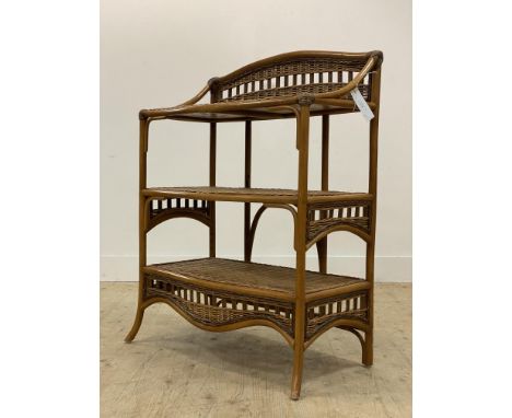 A 1970's bamboo and rattan three tier wall shelf. H103cm, W77cm, D43cm.