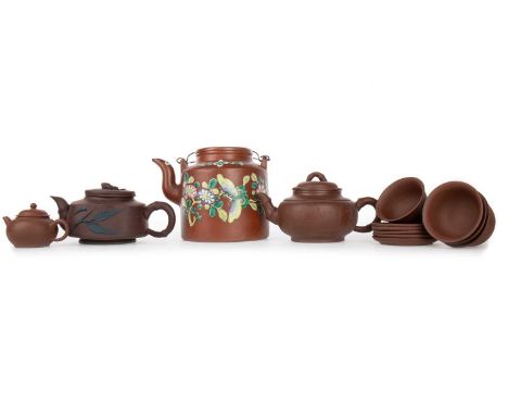 GROUP OF CHINESE YIXING TEA POTS AND OTHER CHINESE YIXING PIECES, the largest tea pot decorated with flowers and a butterfly,