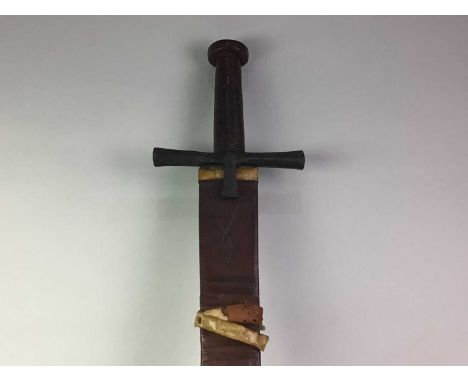NORTH AFRICAN NATIVE SWORD, in leather scabbard108cm long Blade is 90cm long and between 3cm and 4.5cm deep. Further images n