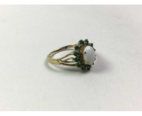 OPAL AND EMERALD RING, in nine carat gold, size NQty: 1.9g