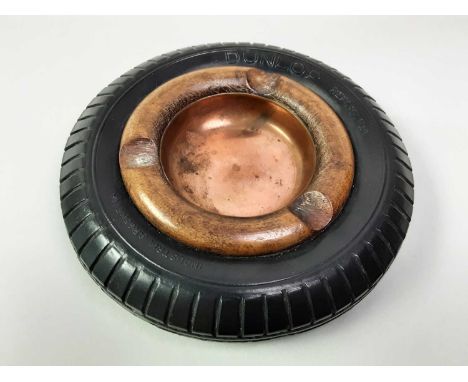 MOTOR INTEREST, NOVELTY DUNLOP ASHTRAY,  the circular copper ashtray surrounded by a dunlop tyre, marked Dunlop to reverse  1